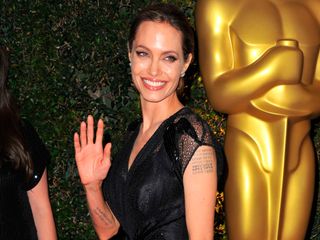 Angelina Jolie puts her slim figure on display at the Oscars