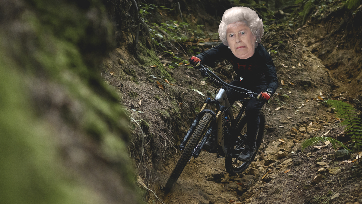 A comedic photo of a mountain biker with the Queen&#039;s face superimposed