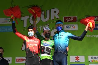 RIVA DEL GARDA ITALY APRIL 23 Pello Bilbao Lpez of Spain and Team Bahrain Victorious Simon Yates of United Kingdom and Team BikeExchange Green Leader Jersey Aleksander Vlasov of Russia and Team Astana Premier Tech celebrate at final podium during the 44th Tour of the Alps 2021 Stage 5 a 1209km stage from Valle del Chiese Idroland to Riva del Garda Mask Covid Safety Measures TourofTheAlps TouroftheAlps on April 23 2021 in Riva del Garda Italy Photo by Tim de WaeleGetty Images
