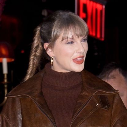Taylor Swift copies a Hailey Bieber outfit in a brown Doen dress