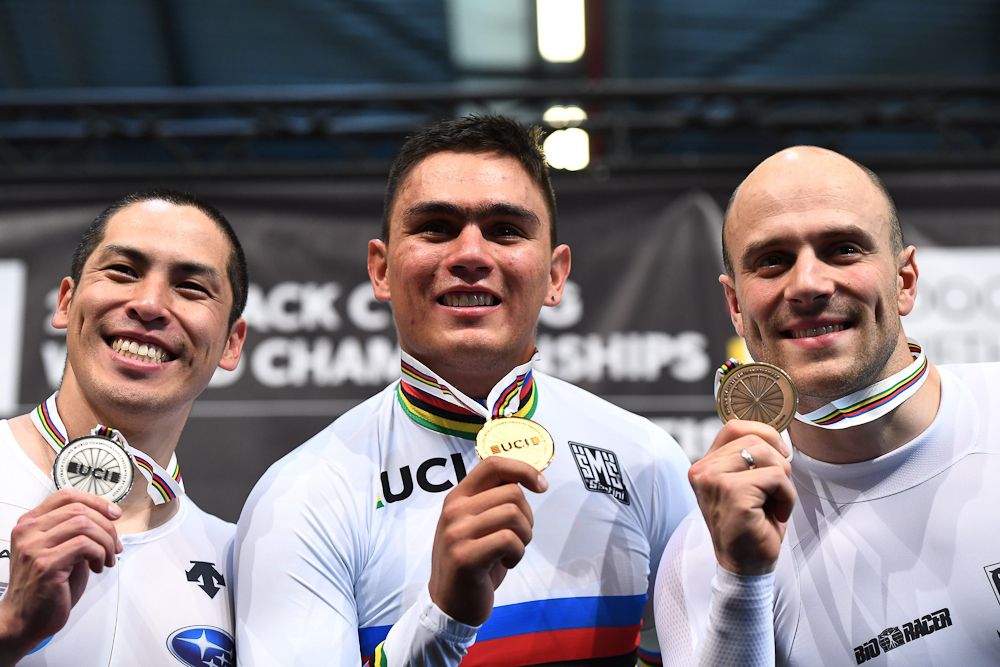 Silver medallist Japan's Tomoyuki Kawabata, gold medallist Colombia's Fabian Hernando Puerta Zapata celebrates and bronze medallist Germany's Maximilian Levy