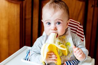 Baby with banana