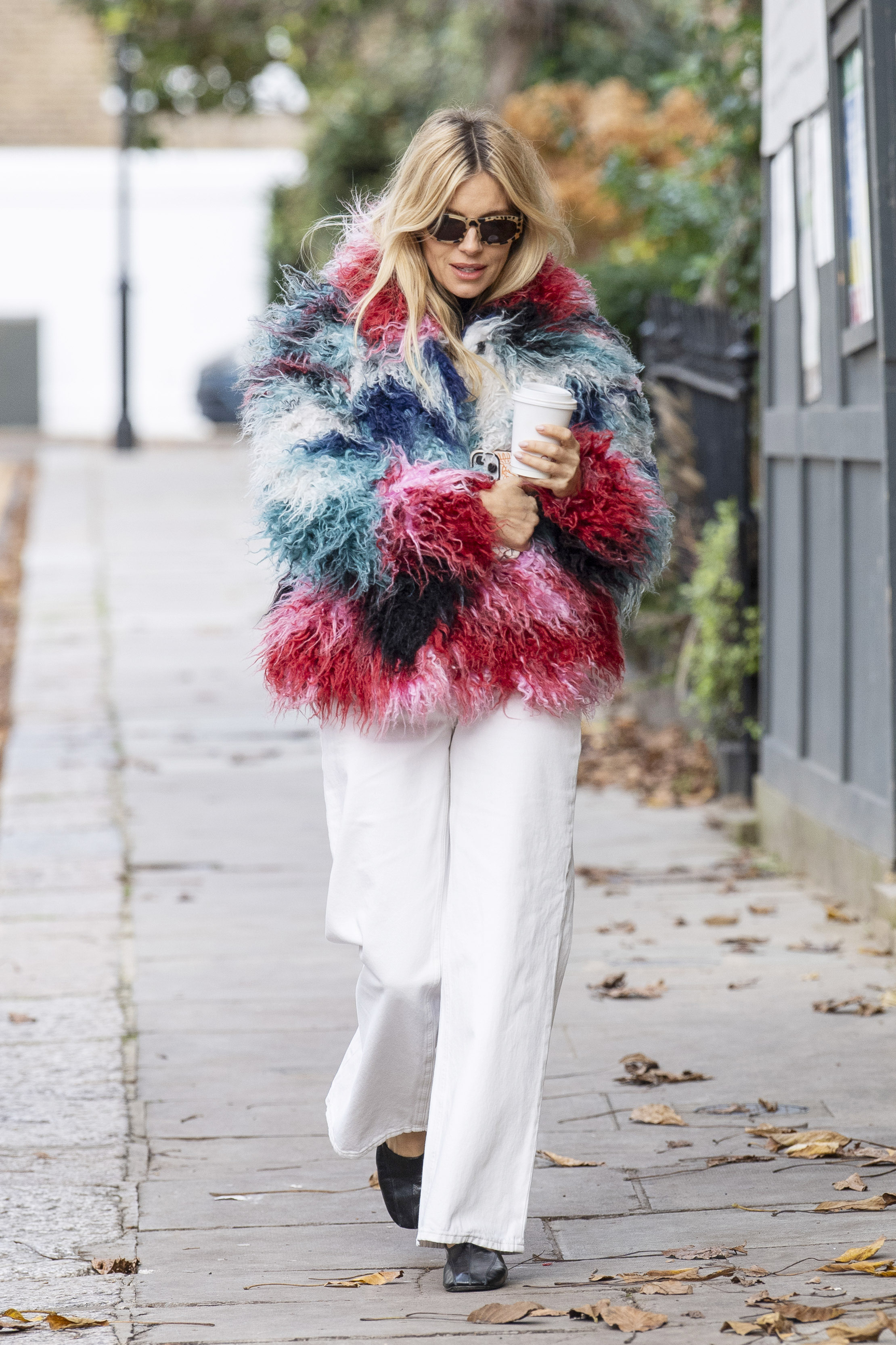 Sienna Miller was spotted in London wearing unseasonal white jeans and ballet flats