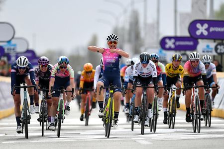 WAREGEM BELGIUM MARCH 30 Chiara Consonni of Italy and Valcar Travel Service Team celebrates winning ahead of Julie De Wilde of Belgium and PlanturPura Team Elise Chabbey of Switzerland and Canyon SRAM Racing Team Pfeiffer Georgi of United Kingdom and Team DSM and Marta Bastianelli of Italy and UAE Team Adq during the 10th Dwars door Vlaanderen 2022 Womens Elite a 120km one day race from Waregem to Waregem DDV22 DDVwomen on March 30 2022 in Waregem Belgium Photo by Luc ClaessenGetty Images