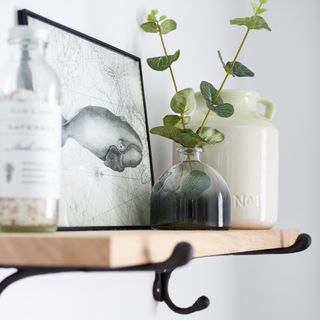 wooden shelf with frame and glass pot