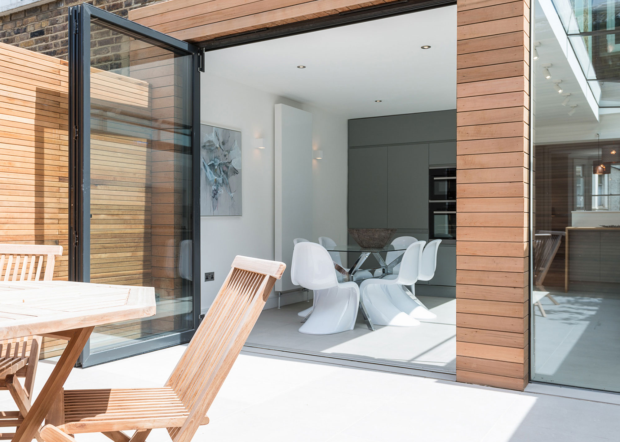 timber clad extension with oversized bifold doors and level threshold