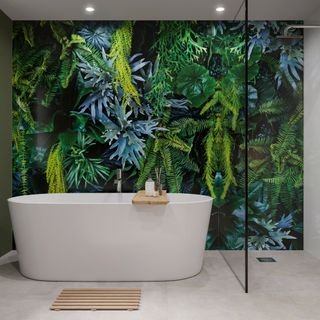 Large-format wall panels in a bathroom with a tropical pattern behind a freestanding bath