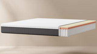 The Emma Lite Mattress with a cutaway showing the internal foam and spring layers