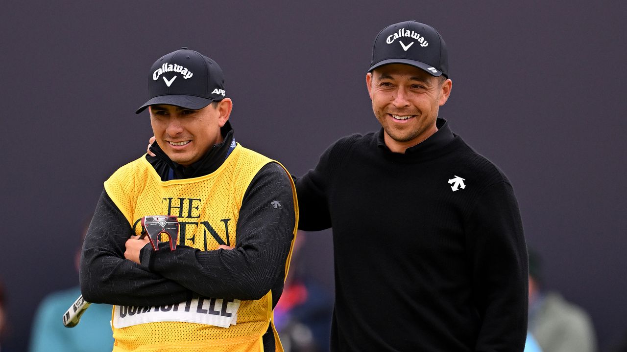 Xander Schauffele (right) and his caddie Austin Kaiser look on at the 152nd Open Championship