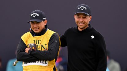 Xander Schauffele (right) and his caddie Austin Kaiser look on at the 152nd Open Championship