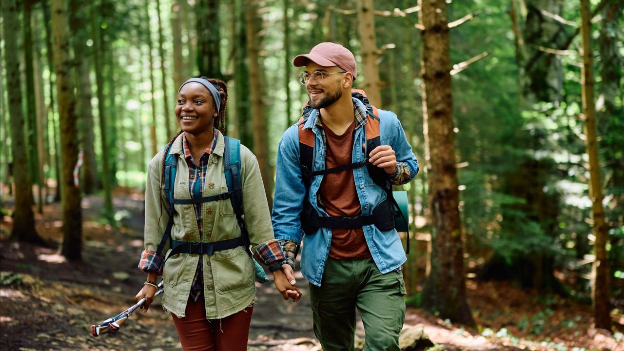 A couple hiking through the woods