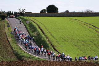 The pack rides in Mesnil-Racoin during the 2nd stage of the Paris-Nice cycling race, 179 km between Thoiry and Montargis, on March 4, 2024. (Photo by Thomas SAMSON / AFP)