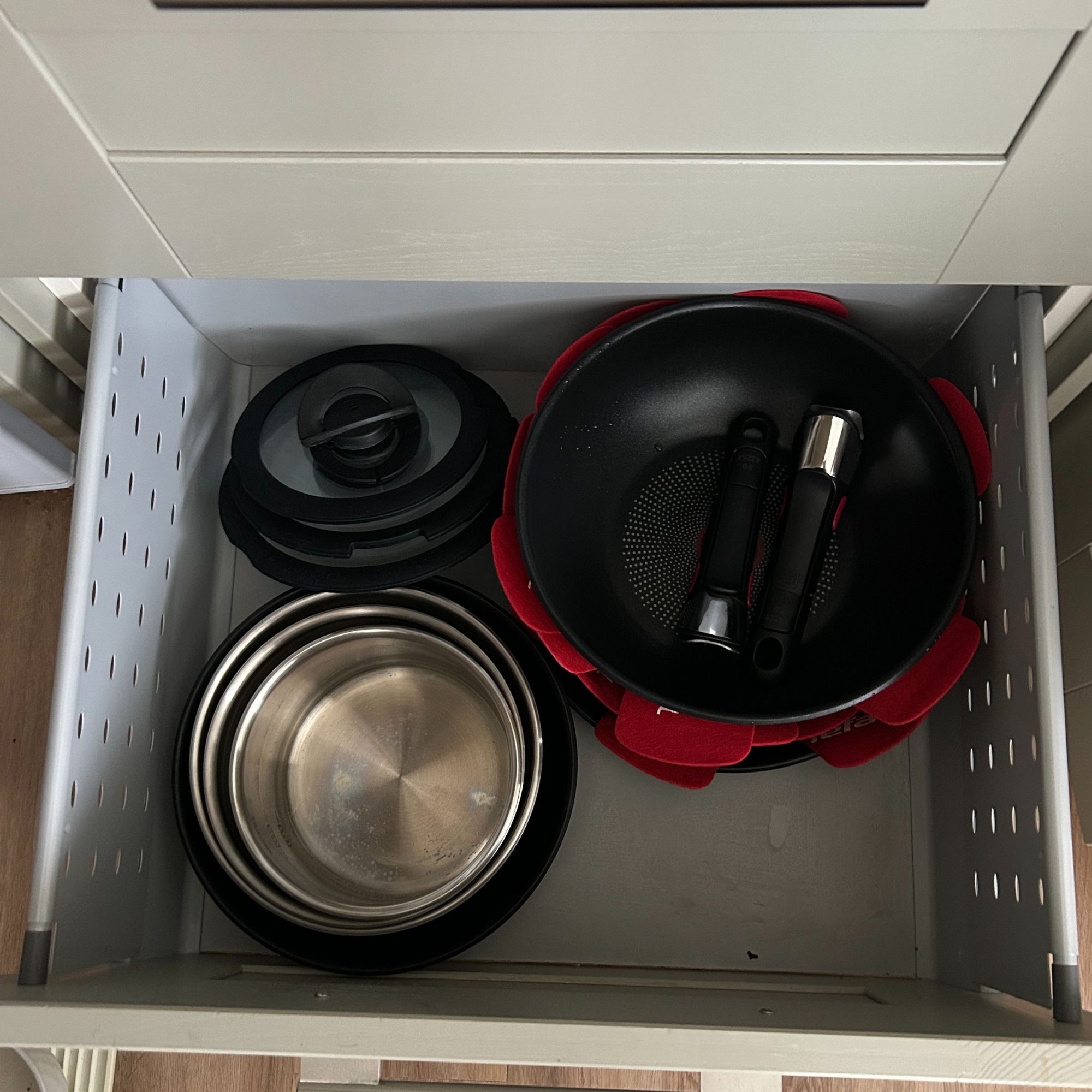 Tefal Ingenio Emotion 22-Piece Pan Set stacked for storing in a drawer