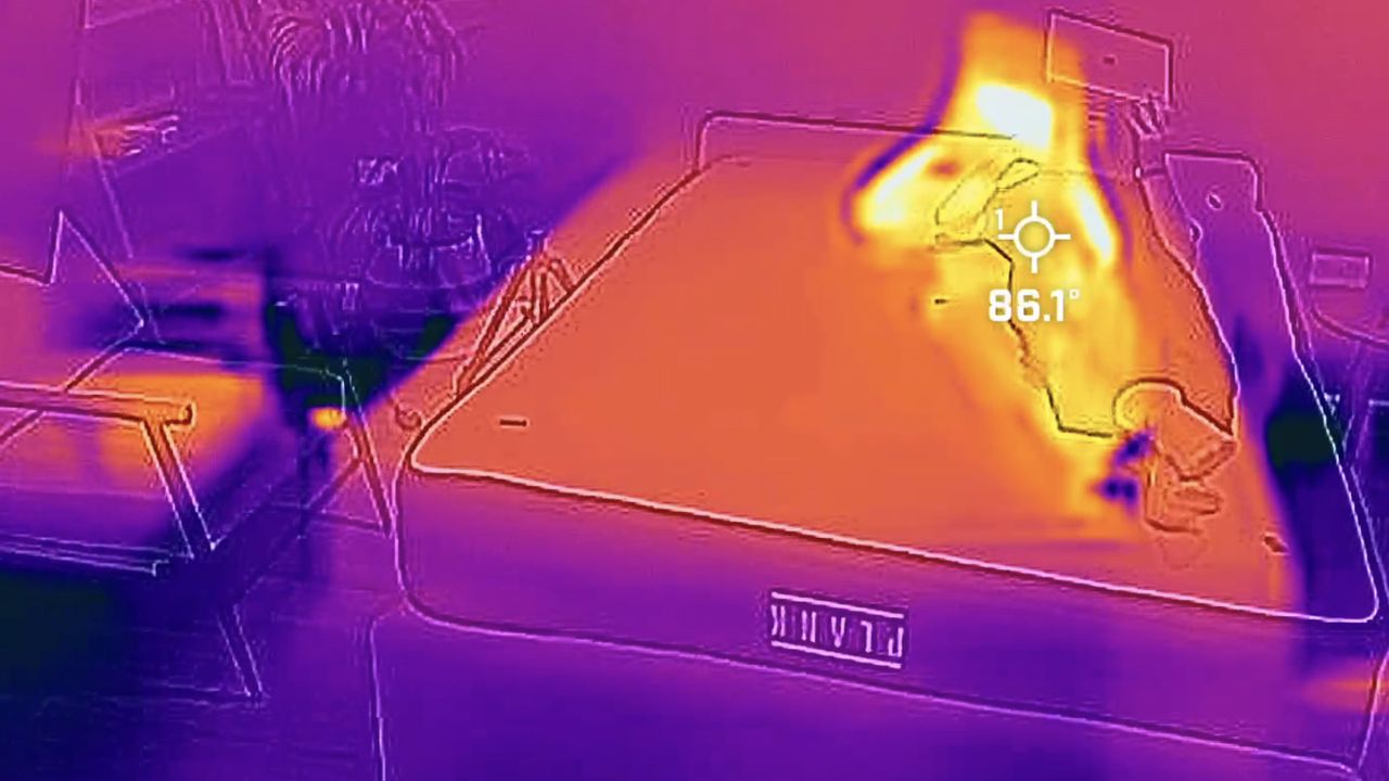 A thermal cam image showing tester Nicola Appleton lying on the Plank Firm Luxe mattress. She creates a notable warmer shape than the rest of the mattress.
