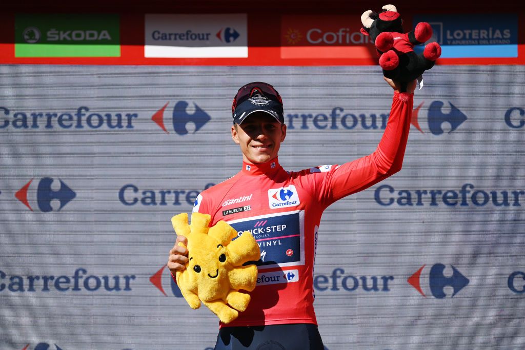 ALTO DEL PIORNAL SPAIN SEPTEMBER 08 Remco Evenepoel of Belgium and Team QuickStep Alpha Vinyl celebrates winning the Red Leader Jersey on the podium ceremony after the 77th Tour of Spain 2022 Stage 18 a 192km stage from Trujillo to Alto del Piornal 1163m LaVuelta22 WorldTour on September 08 2022 in Alto del Piornal Caceres Spain Photo by Justin SetterfieldGetty Images