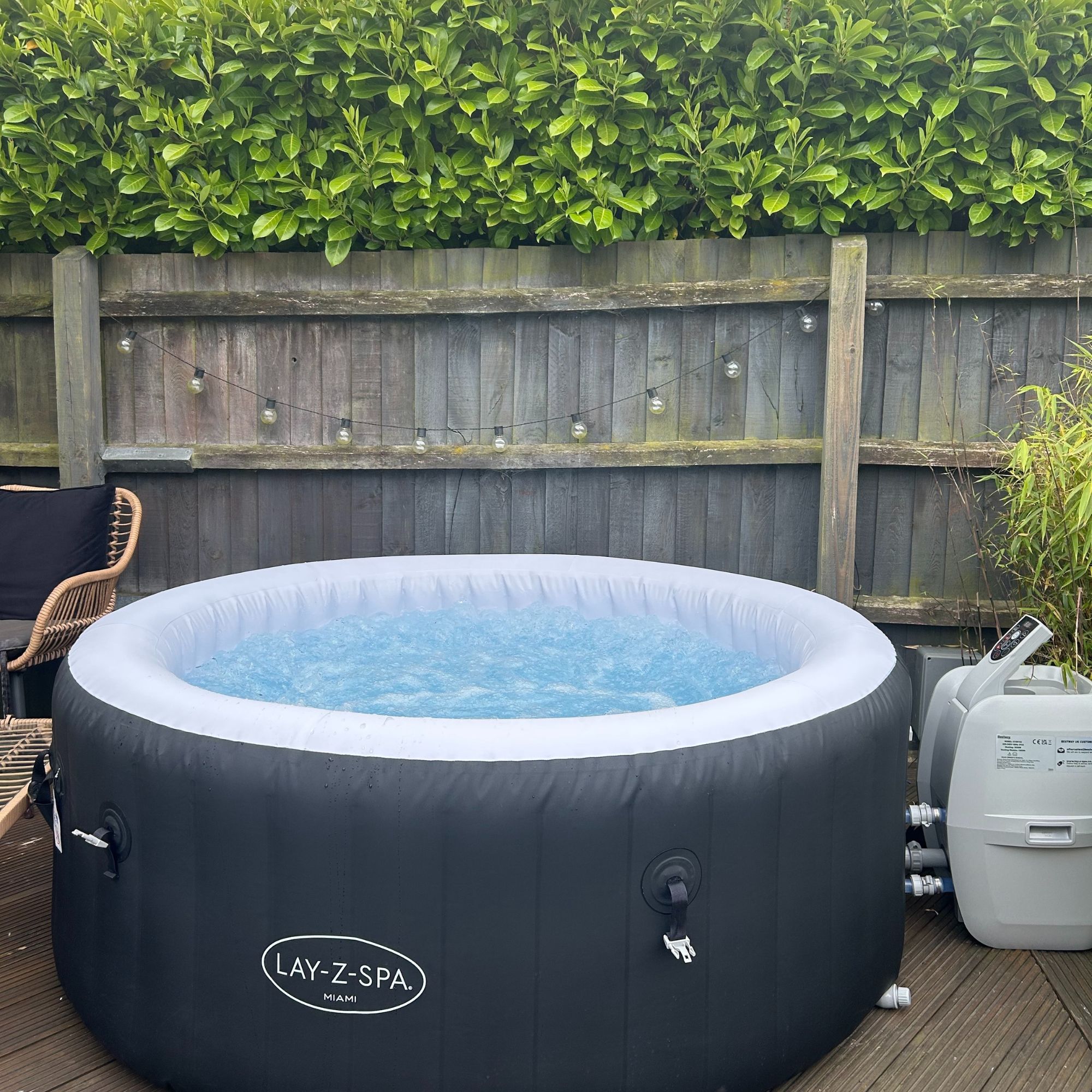 Lay-Z-Spa Miami, turned on with bubbles in garden on decking