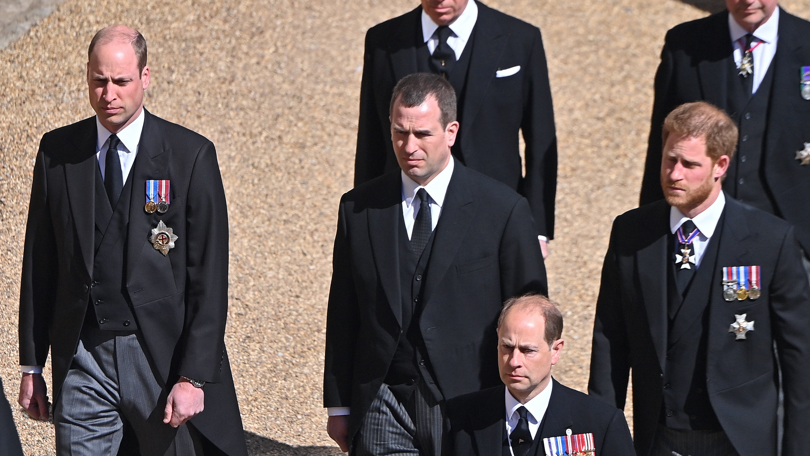 Prince William, Peter Phillips and Prince Harry follow Prince Philip's coffin during his funeral procession to St. George's Chapel, Windsor Castle on April 17, 2021