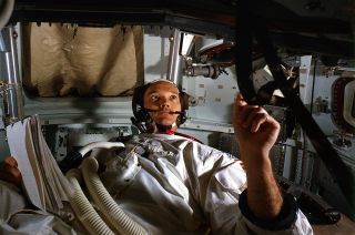 Apollo 11 command module pilot Michael Collins trains aboard a spacecraft simulator in preparation for the 1969 mission.