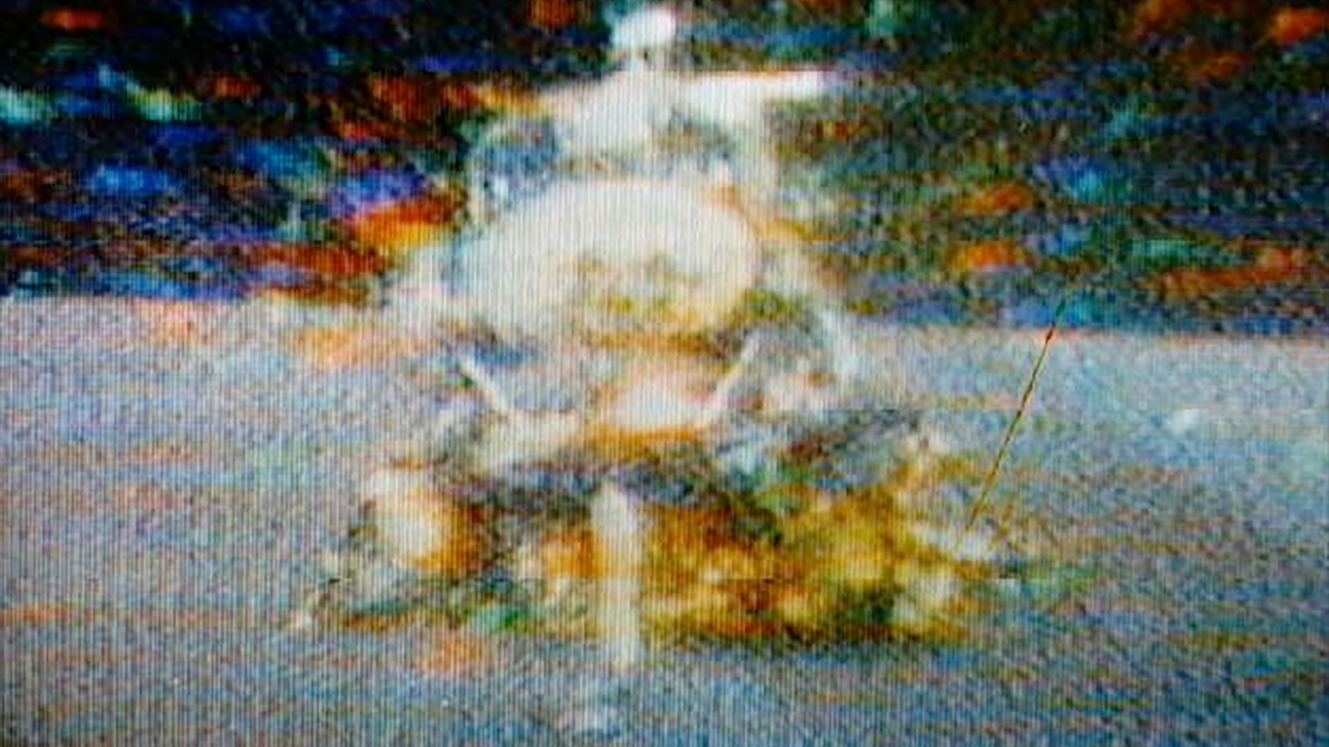 a low resolution television still of a spacecraft blasting off the moon