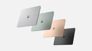 Vier Surface Laptop 5 Modelle in verschiedenen Farben auf weißem Hintergrund.