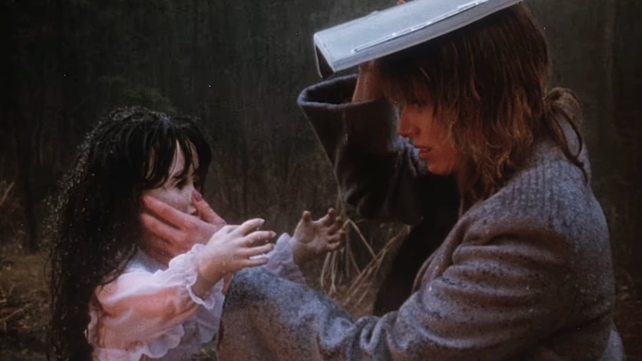 Amanda touching doll in the middle of the road in Curtains