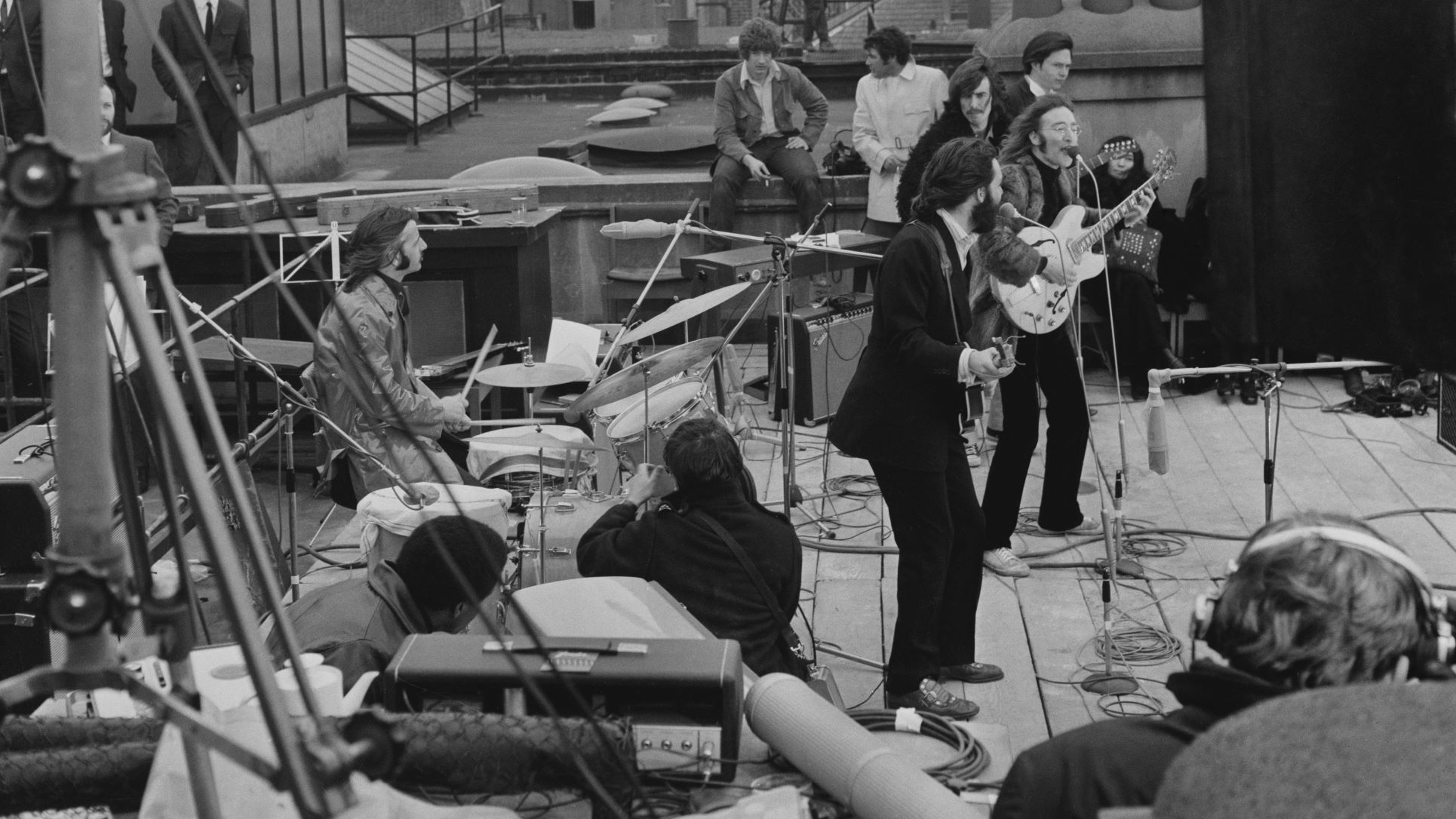 The Beatles performing their last live public concert on the rooftop of the Apple Organization building for director Michael Lindsey-Hogg's film documentary, 'Let It Be,' on Savile Row, London, UK, 30th January 1969.