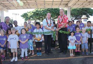 A school blessing ceremony for a new PV canopy, part of the Ka Hei initiative. 