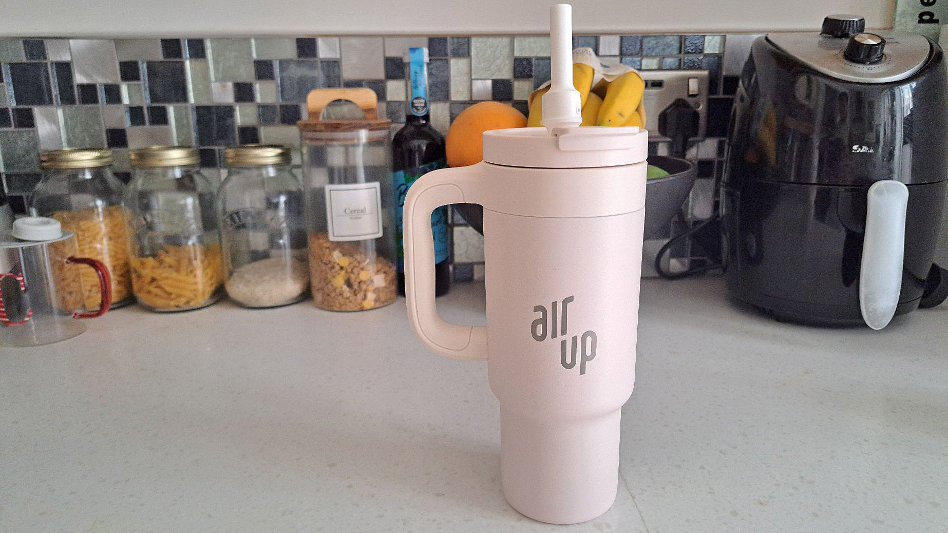 Cream air up tumbler on countertop