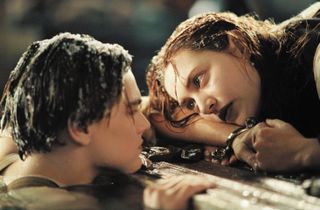 (L, R) Leonardo DiCaprio as Jack, in the water next to Kate Winslet as Rose, on the door, in Titanic