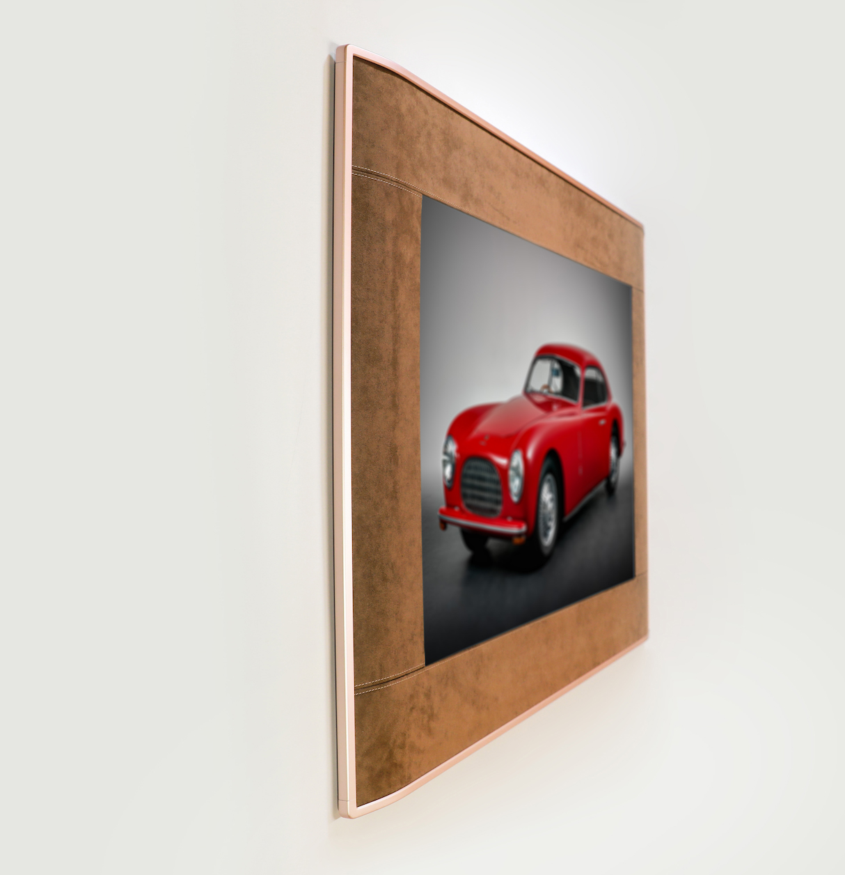 A digital art frame on a wall