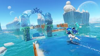 Astro Bot ice skates along a path in one of the recent speedrun levels added to the game, a suction elephant on his back ready to create more frozen pathways