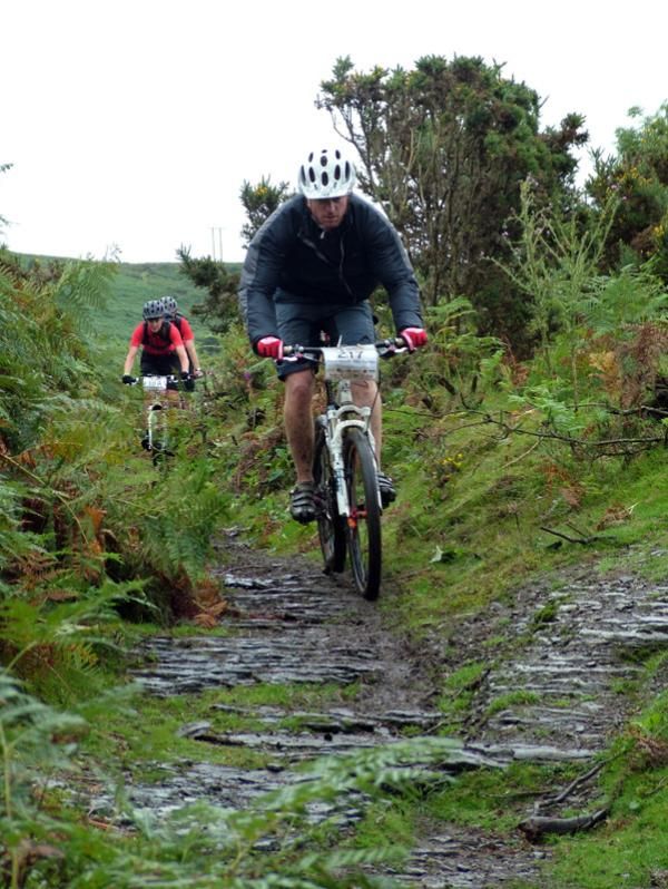 Riders cruise along during a linking stage.