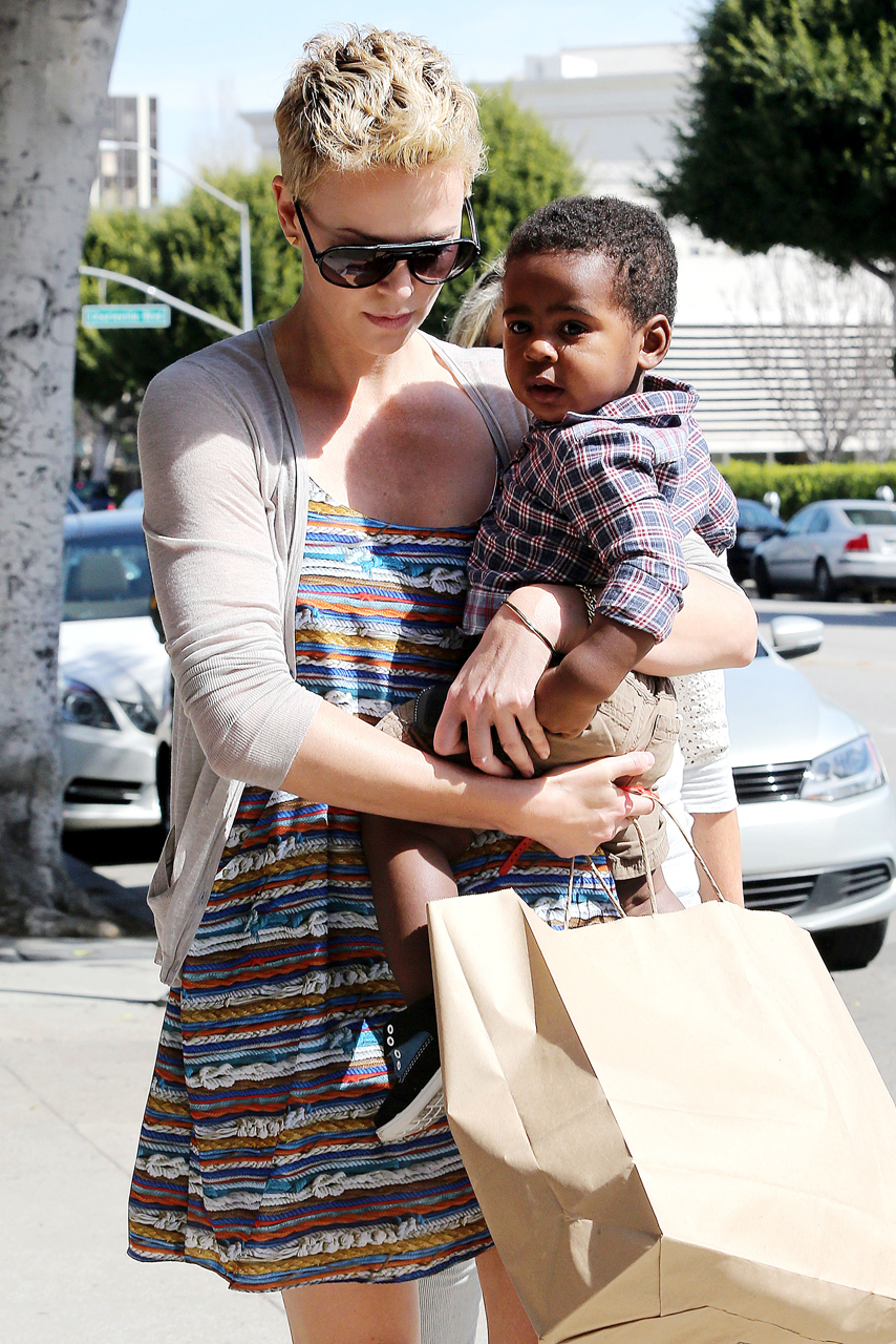 charlize theron son wearing dress