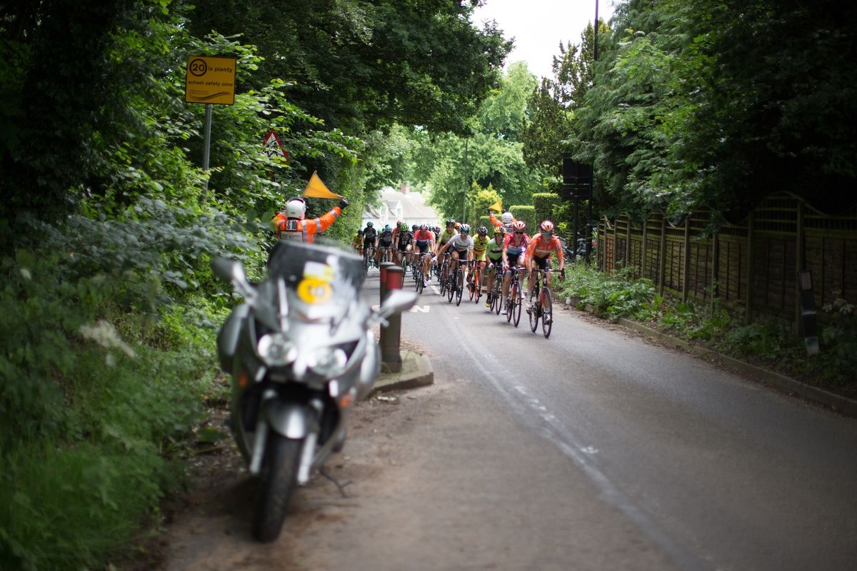 The peloton dodges road furniture during stage 4 of the Aviva Women's Tour 2016