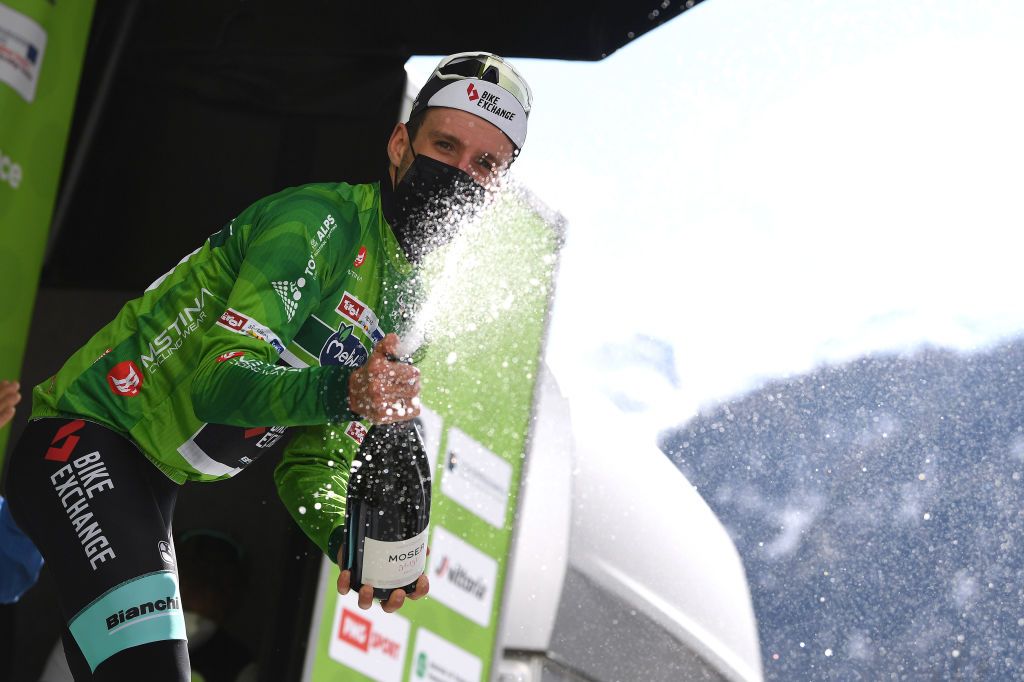 FEICHTEN IM KAUNERTAL AUSTRIA APRIL 20 Simon Yates of United Kingdom and Team BikeExchange Green Leader Jersey celebrates at podium during the 44th Tour of the Alps 2021 Stage 2 a 1215km stage from Innsbruck to Feichten im Kaunertal 1291m Champagne Mask Covid Safety Measures TourofTheAlps TouroftheAlps on April 20 2021 in Feichten im Kaunertal Austria Photo by Tim de WaeleGetty Images