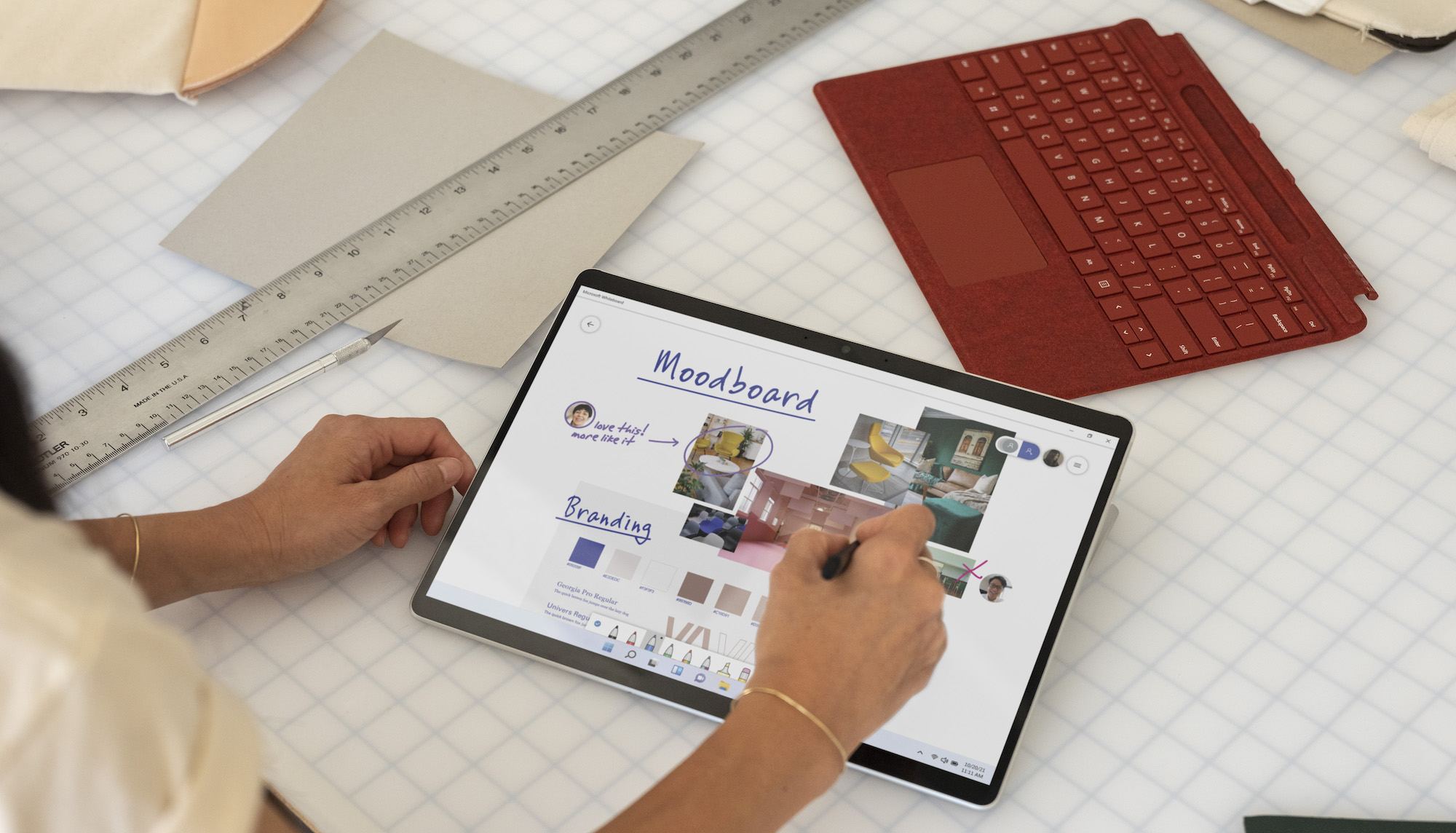 Person drawing on Microsoft Surface Pro X 2021