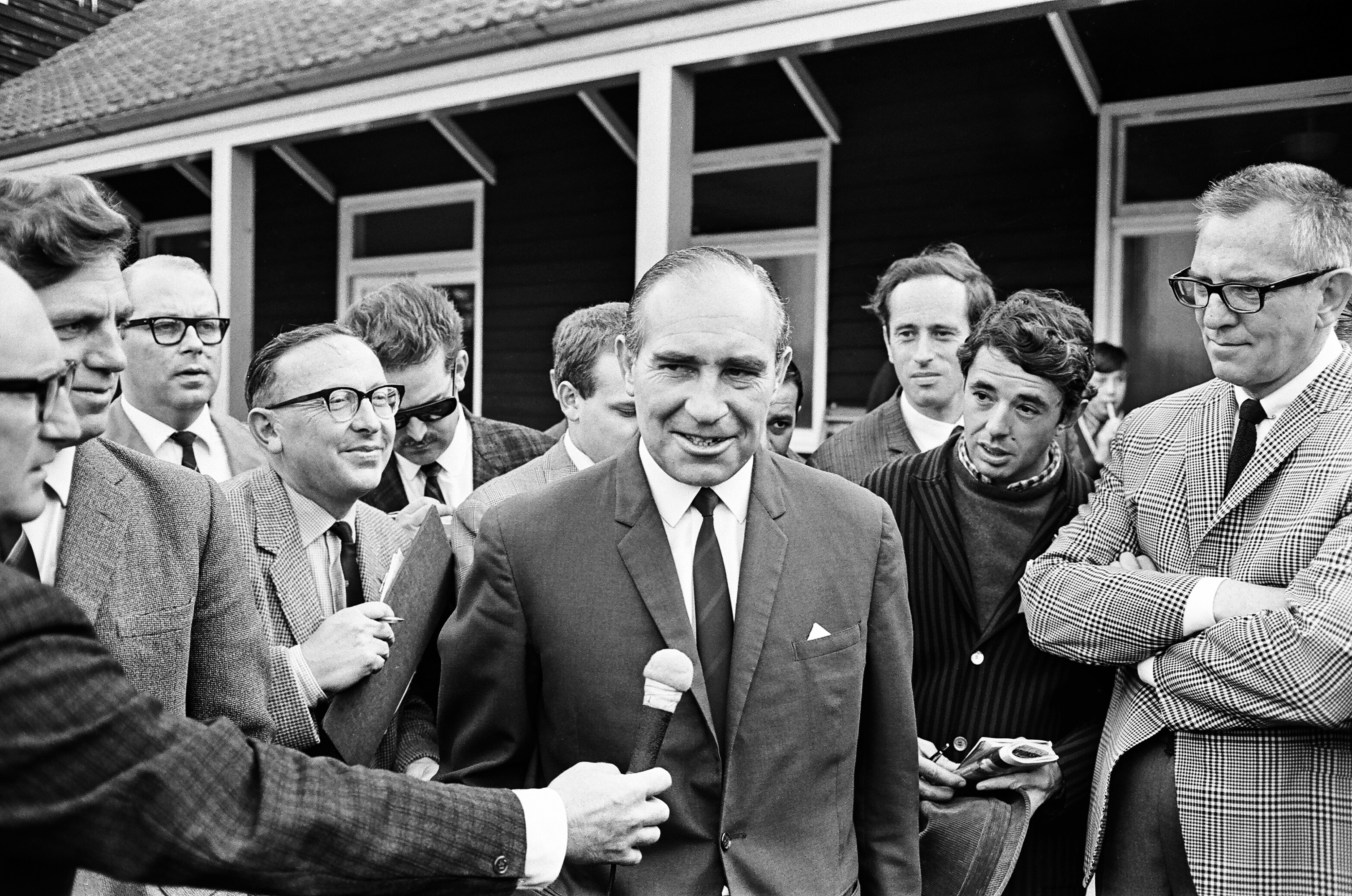 ABeseiged by the media, Alf Ramsey forced a smile as he evaluated his side's chances on the eve of the final, 29th July 1966. *** Local Caption *** England manager Alf Ramsey speaks to the press
