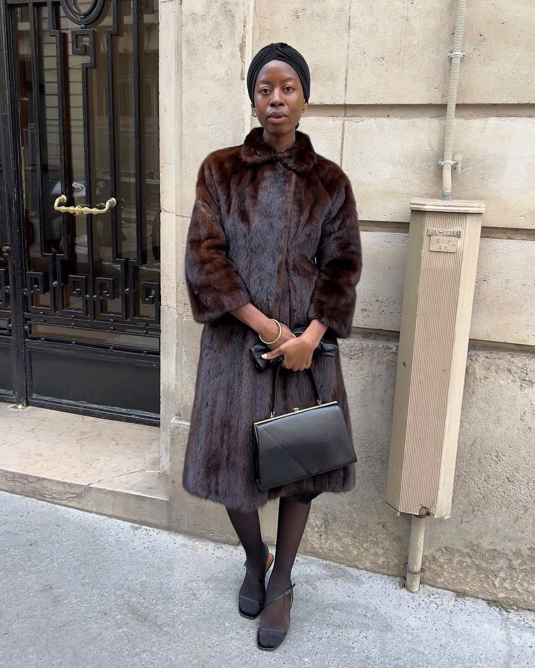 Influencer Sylvie Mus wearing ladylike accessories and a vintage fur coat.