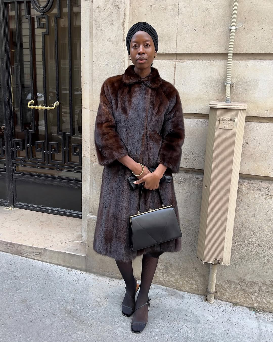 Influencer Sylvie Mus wearing ladylike accessories and a vintage fur coat.
