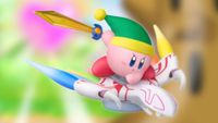 Image of the new Sword Kirby amiibo sitting on a blurred Kirby Air Riders game screenshot.