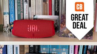 My favourite speaker, the JBL Charge 5, on my bookshelf.