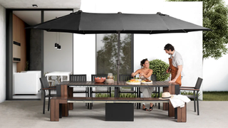 A large outdoor dining set with a bench, chairs, and an umbrella
