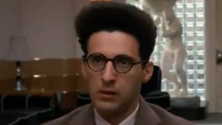 John Turturro looking confused in a close up from Barton Fink