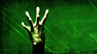 A zombie hand missing a thumb rises into view