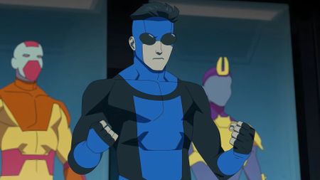 Mark Grayson (Steven Yeun) as Invincible in his blue suit during a scene from "Invincible" season 3 on Prime Video.