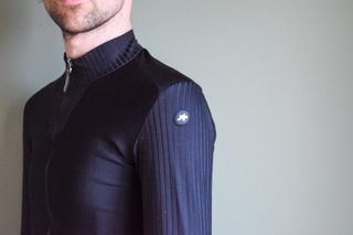 A male cyclist wearing a bloack Thermobooster base layer