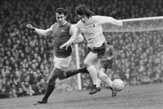 Arsenal's Ray Kennedy (left) challenges for the ball in a derby against Tottenham in April 1973.