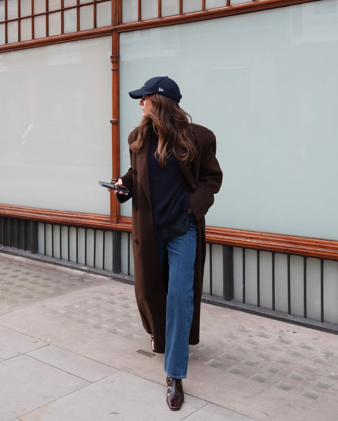 @kimturkington_ wears jeans brown coat, brown boots