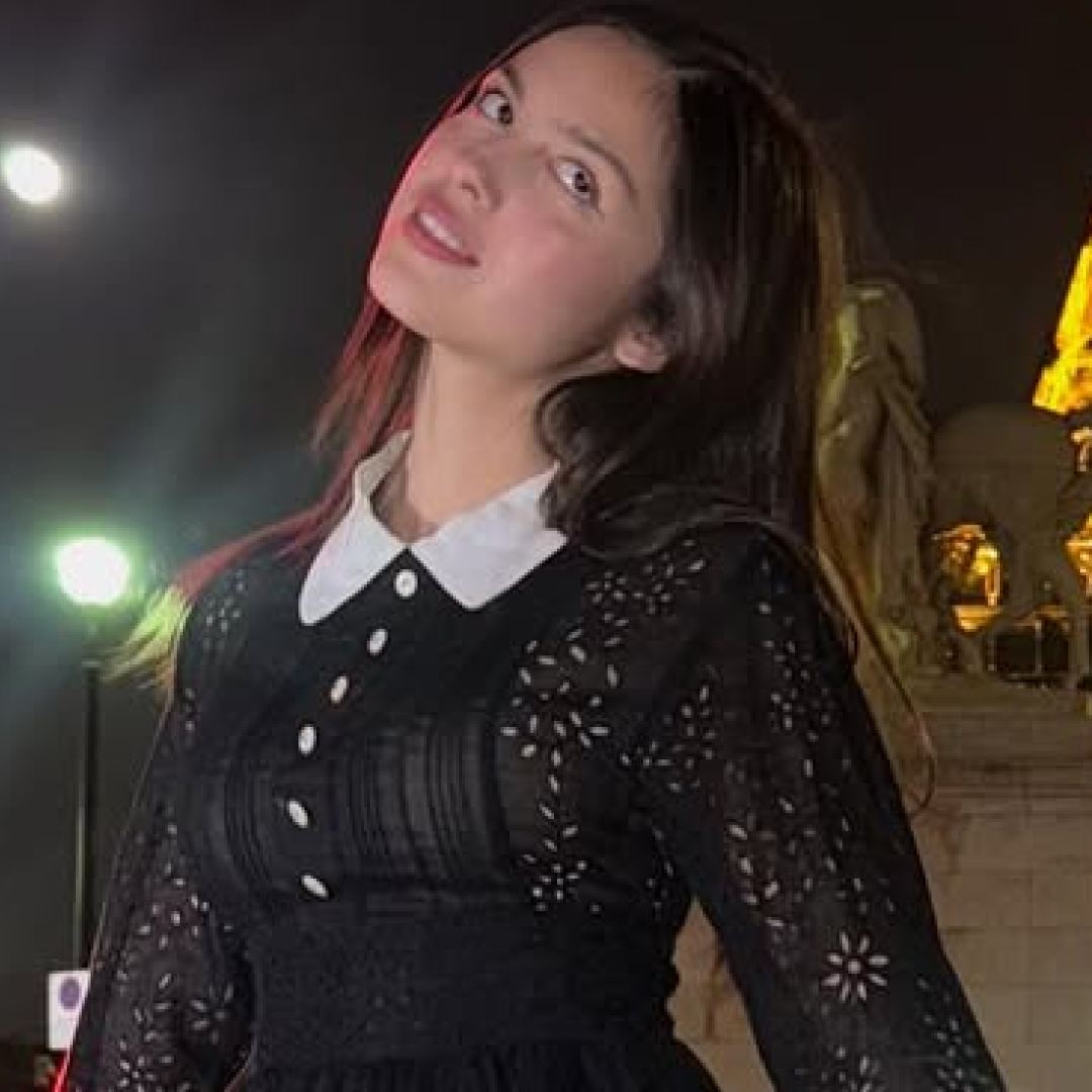 Olivia Rodrigo posed outside the Eiffel Tower in a vintage little black dress from Anna Sui Spring 1994