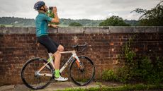 Image shows a 40 year old rider fuelling on a bike ride.